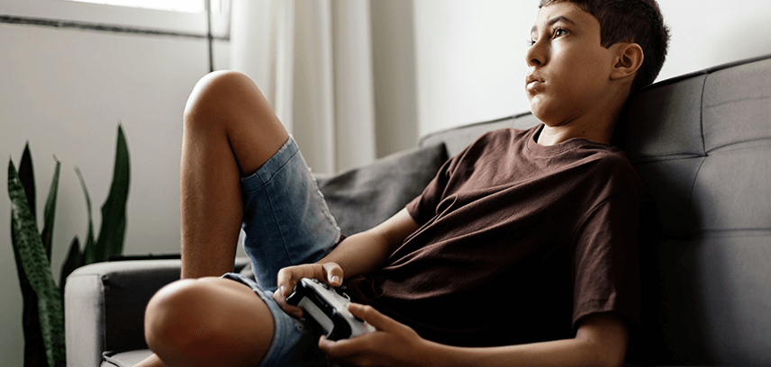 Teen playing Xbox