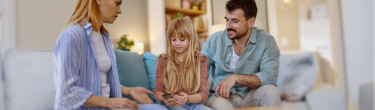 Parents giving their child a dumb phone
