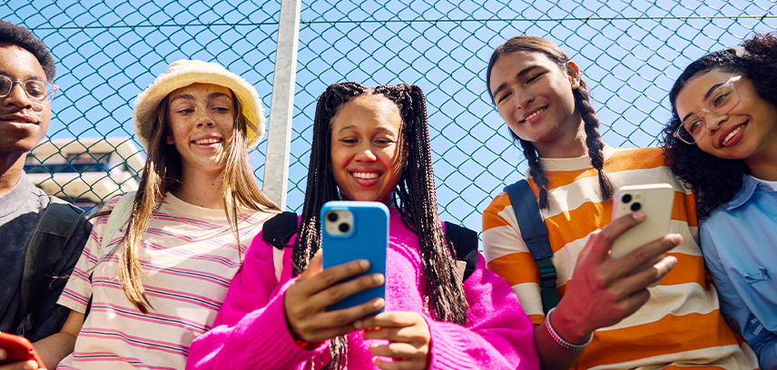 teens having fun on their phones in free time
