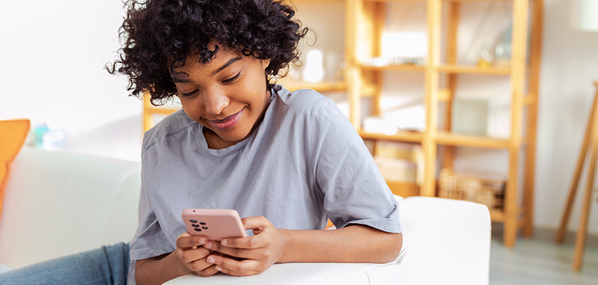 teen girl looking at AI videos on phone 