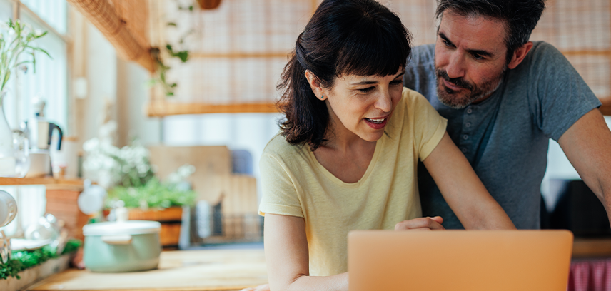 Parents checking laptop