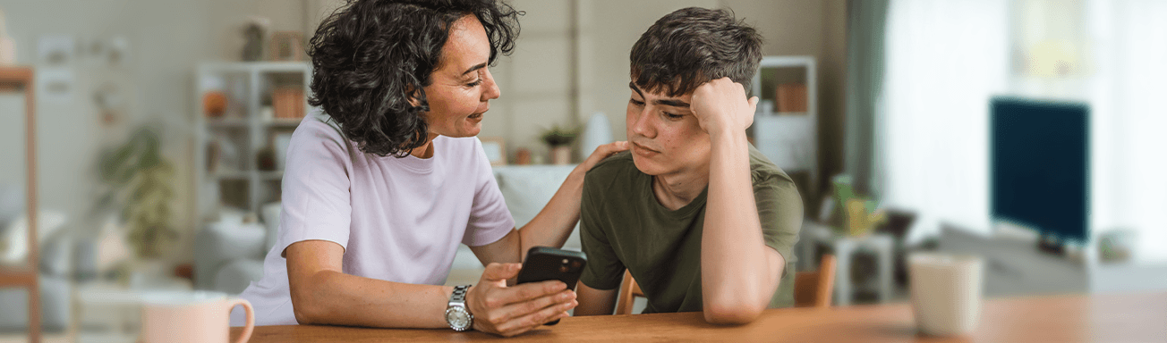 Mother and teen son discussing screen time